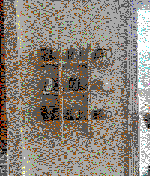 a wooden grid shelf mounted on the wall with cups